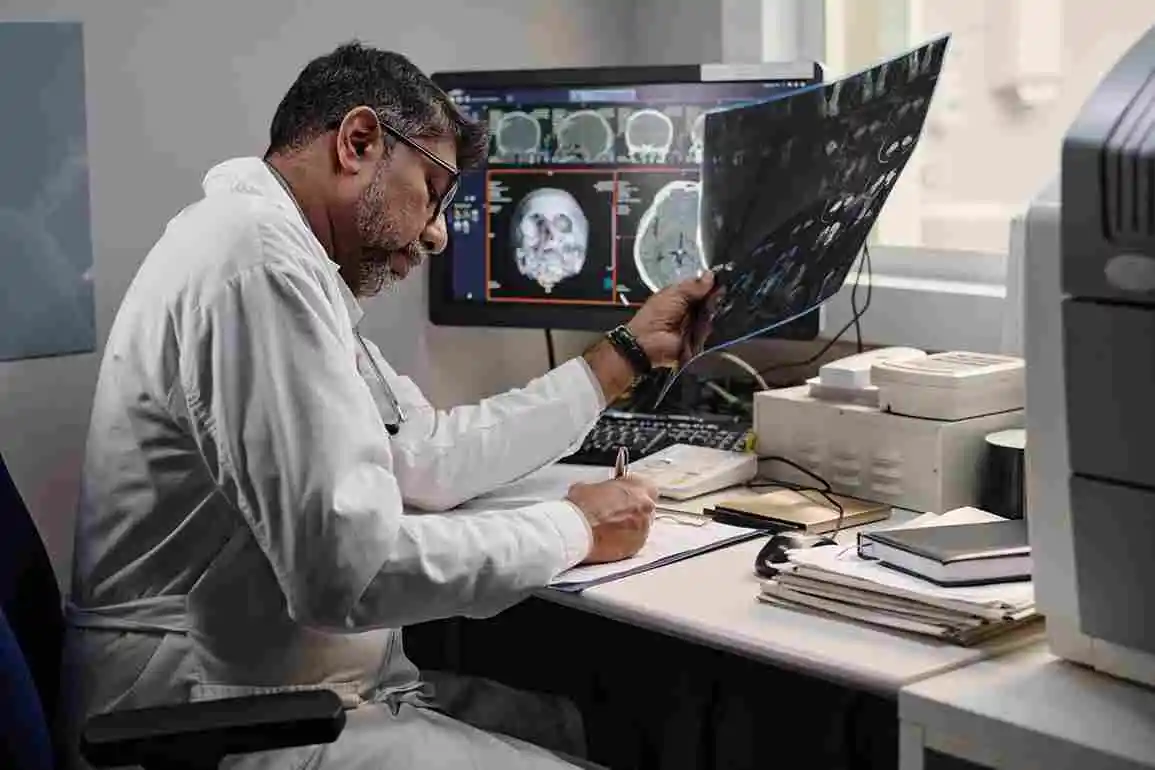doctor working with ct scan results