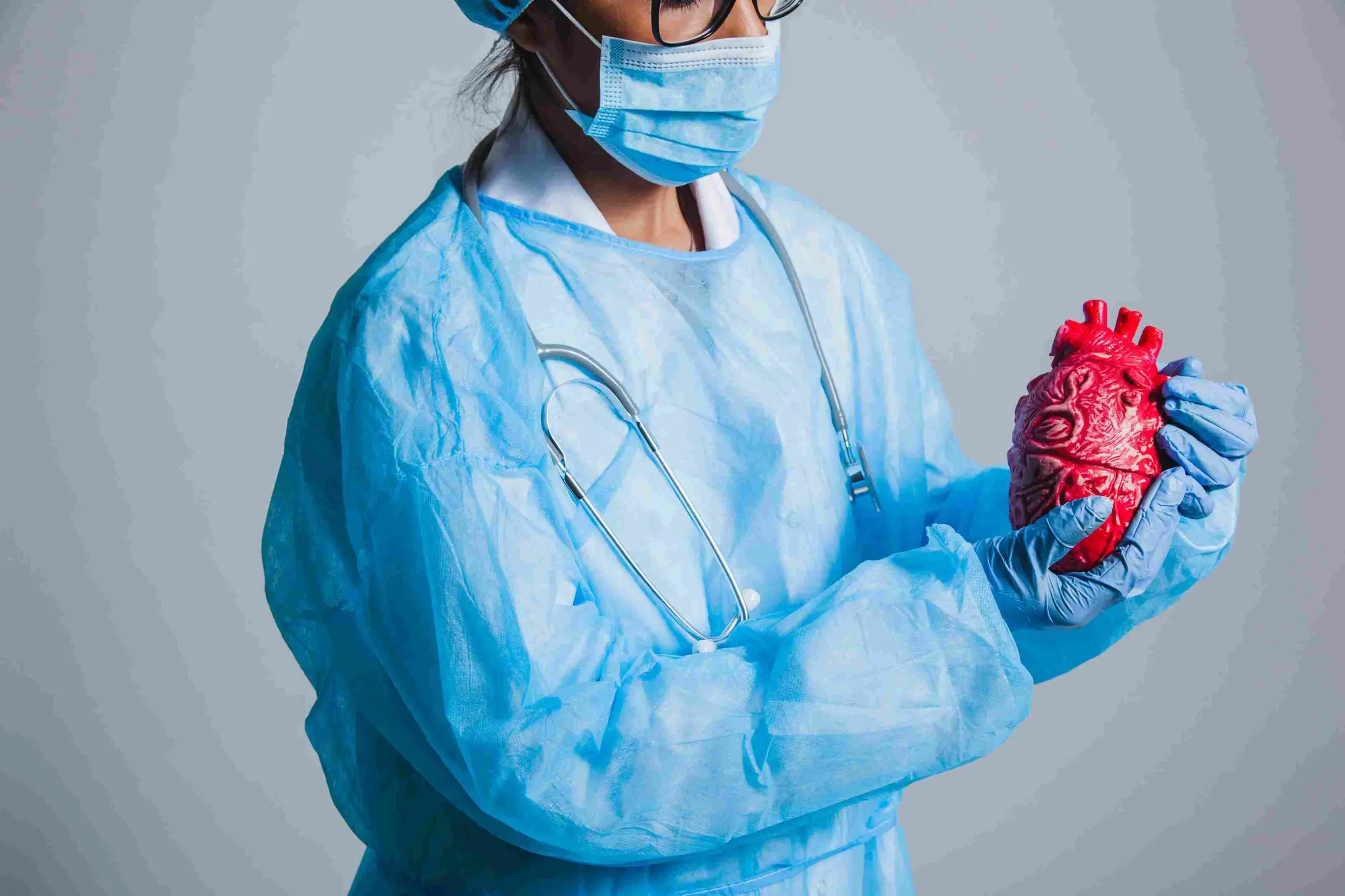 surgeon posing with heart